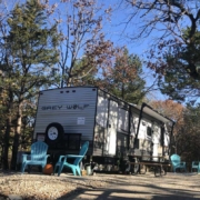 Level gravel RV site with full hook-ups at Branson Shenanigans RV Park