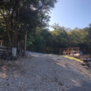 Level gravel RV site with full hook-ups at Branson Shenanigans RV Park