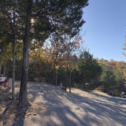Level gravel RV site with full hook-ups at Branson Shenanigans RV Park