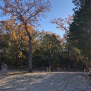 Level gravel RV site with full hook-ups at Branson Shenanigans RV Park