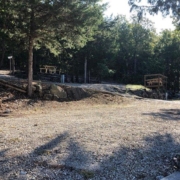 Level gravel RV site with full hook-ups at Branson Shenanigans RV Park