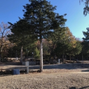 Level gravel RV site with full hook-ups at Branson Shenanigans RV Park