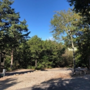 Level gravel RV site with full hook-ups at Branson Shenanigans RV Park