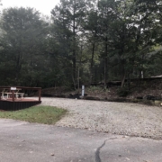Level gravel RV site with full hook-ups at Branson Shenanigans RV Park