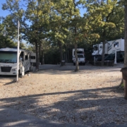 Level gravel RV site with full hook-ups at Branson Shenanigans RV Park