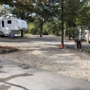 Level gravel RV site with full hook-ups at Branson Shenanigans RV Park