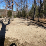 Level gravel RV site with full hook-ups at Branson Shenanigans RV Park