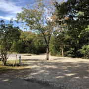 Level gravel RV site with full hook-ups at Branson Shenanigans RV Park