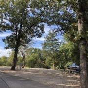 Level gravel RV site with full hook-ups at Branson Shenanigans RV Park