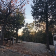 Level gravel RV site with full hook-ups at Branson Shenanigans RV Park