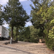 Level gravel RV site with full hook-ups at Branson Shenanigans RV Park