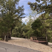 Level gravel RV site with full hook-ups at Branson Shenanigans RV Park