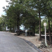 Level gravel RV site with full hook-ups at Branson Shenanigans RV Park
