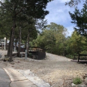 Level gravel RV site with full hook-ups at Branson Shenanigans RV Park