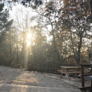 Level gravel RV site with full hook-ups at Branson Shenanigans RV Park