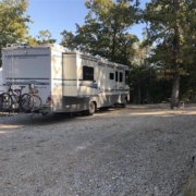 Level gravel RV site with full hook-ups at Branson Shenanigans RV Park
