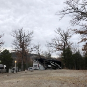 Level gravel RV site with full hook-ups at Branson Shenanigans RV Park