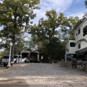 Level gravel RV site with full hook-ups at Branson Shenanigans RV Park