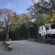 Level gravel RV site with full hook-ups at Branson Shenanigans RV Park