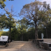 Level gravel RV site with full hook-ups at Branson Shenanigans RV Park