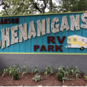 Branson Shenanigans RV Park entrance sign in the evening