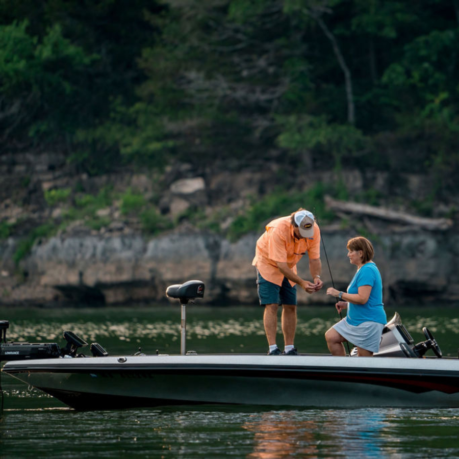 Fishing boat on Table Rock Lake along the wooded Ozark shoreline